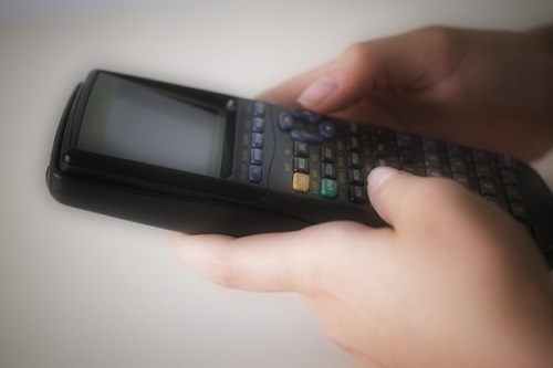 Hands Holding Graphic Calculator