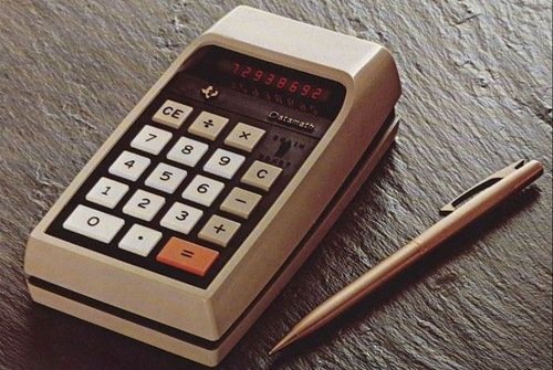 Pencil Next To Old Calculator
